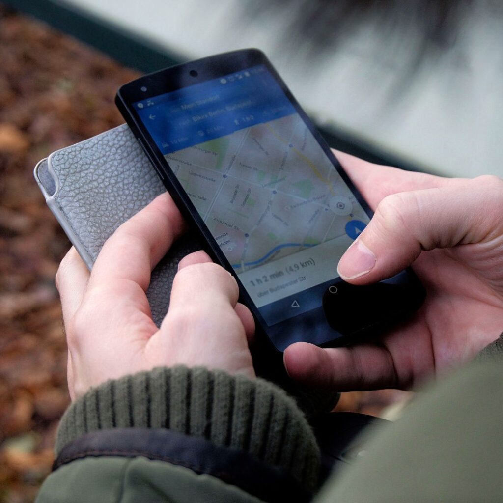 person looking at gps map on phone