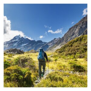 person hiking to camp site