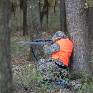 hunter sitting and ready to shoot